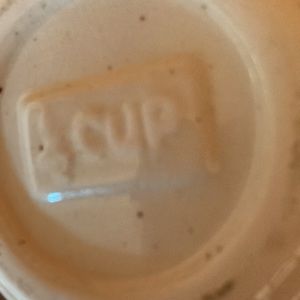 Cups 5 inches tall says on bottom of each cup 1 cup 3 half cups and 1 half cups